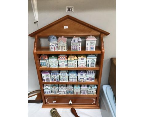 A Lenox fire porcelain spice village in pine rack