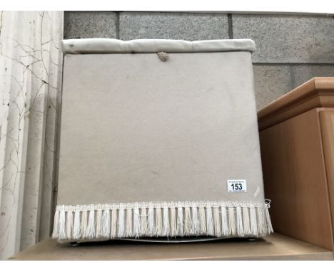A button upholstered storage dressing stool