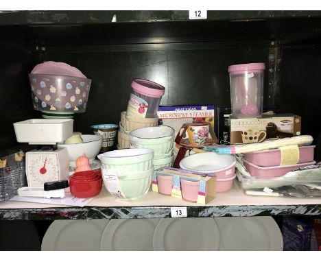 A shelf of kitchenalia including ceramic mixing bowls