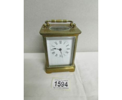 A good brass carriage clock in working order and with key.