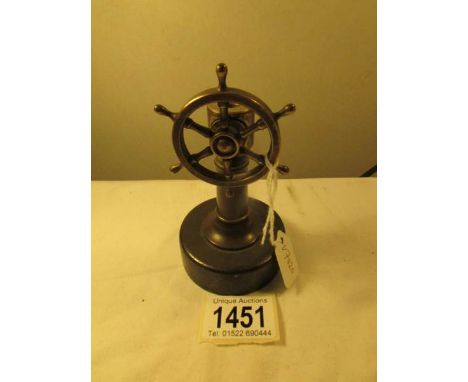 A pipe cutter in the form of a ships wheel.