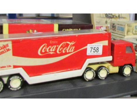 A 1:18 scale Carousel 1 Indianapolis 500 Roadster and a Buddy Coca Cola delivery wagon.