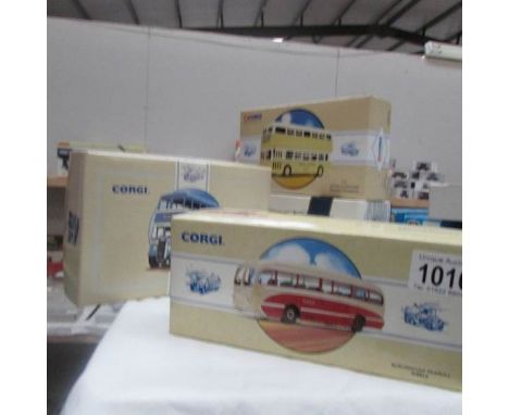 3 Corgi boxed die cast buses and one Dinky.