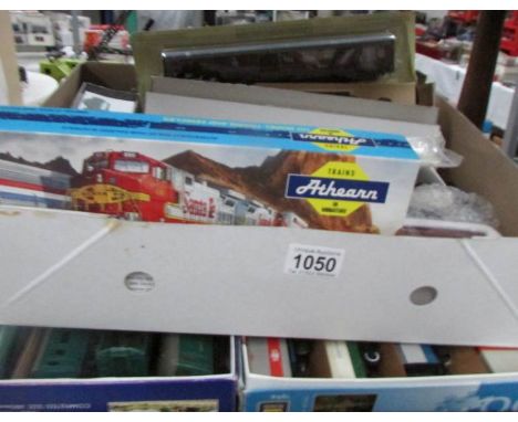 A quantity of '00' gauge rolling stock and plastic steam engine models etc.,