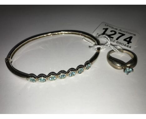 A silver/apatite bracelet and ring.