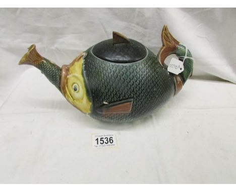 An unusual fish shaped teapot.