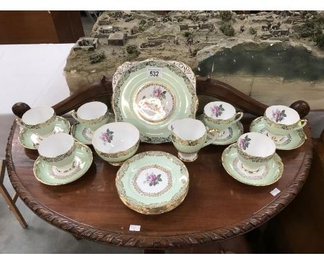 A part Dakin bone china tea set including 6 cups and saucers, 6 tea plates and a jug and bowl