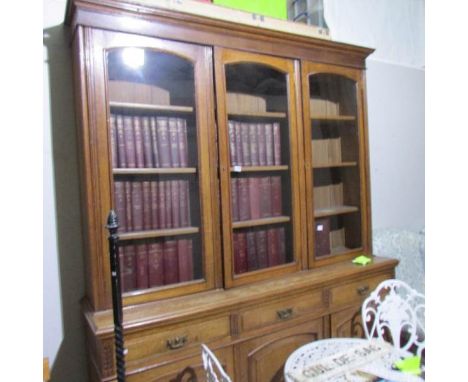 An oak glazed top 3 door bookcase.