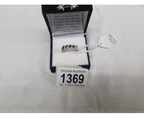 An 18ct gold double band ring set 12 diamonds and 5 sapphires, size Q.