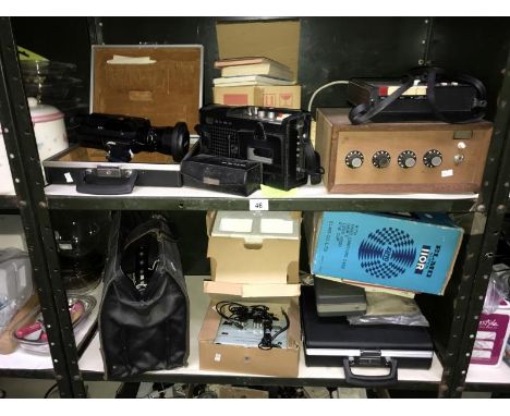 2 shelves of vintage electrical items including film cameras &amp; cassette players etc.