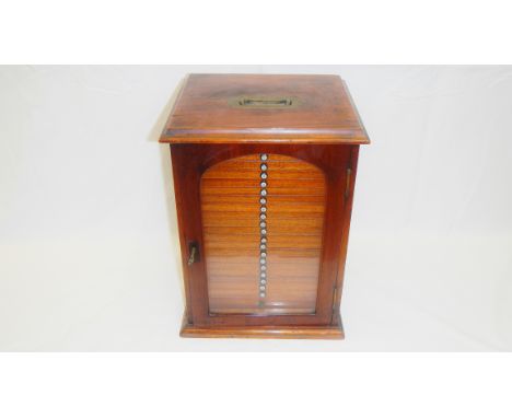 A Victorian mahogany specimen cabinet with glass door and 21 numbered drawers containing microscope slides.