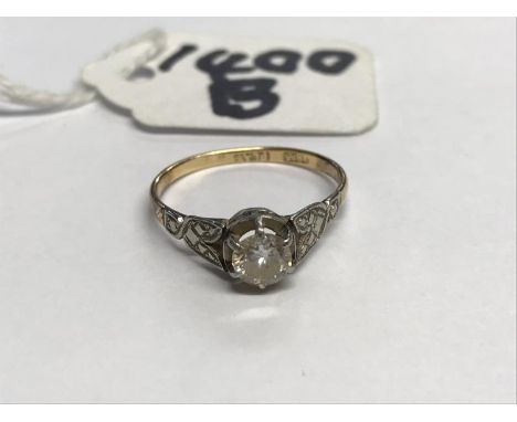 A gold diamond solitaire ring, size J.