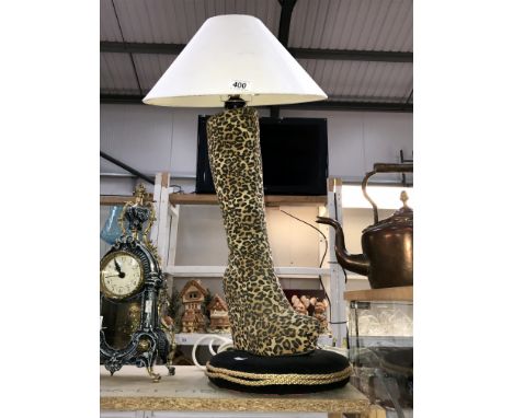 A retro leopard boot table lamp