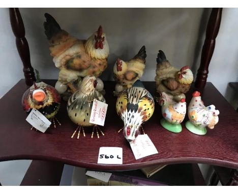 A shelf of chicken ornaments and salt and peppers