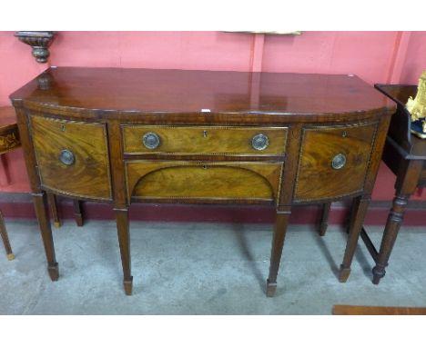 A George III inlaid mahogany bow front sideboard