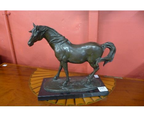 A French style bronze stallion, on black marble base