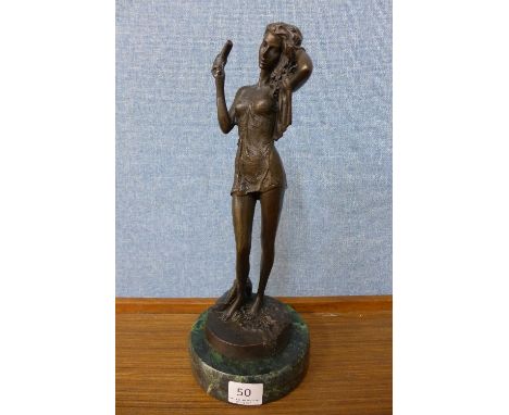 A French style bronze lady, on green marble base