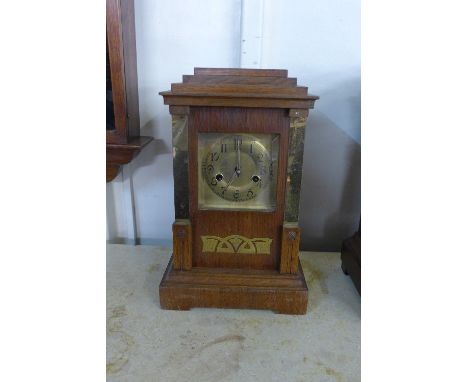 A German Secessionist HAC oak and gilt metal bracket clock