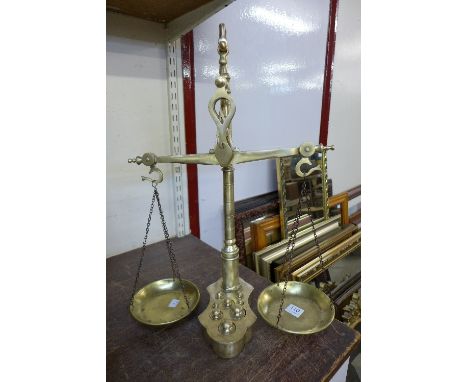 A set of brass scales and weights