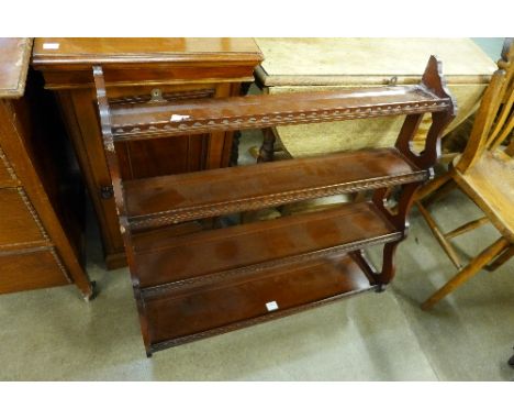 A mahogany wall shelf