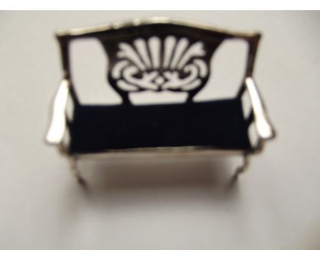 Silver stamped pin cushion, bench