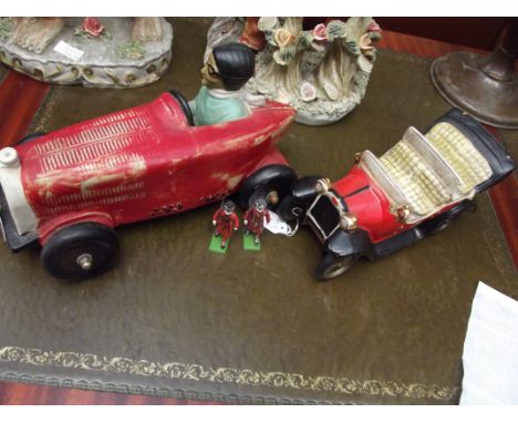 Two ceramic cars together with two Britain beefeaters 