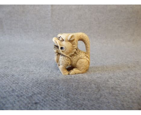 Chinese carved ivory netsuke figure of a dragon, with character marks to the base. PLEASE always check condition before biddi