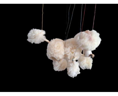A Pelham standard puppet poodle in its original box with instructions poodle is white with pink bow in reasonable condition w