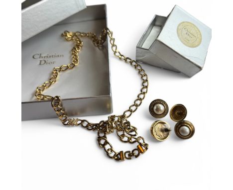 A small collection of Christian Dior costume jewellery.  Comprising two pairs of gold tone post ear studs, one with faux pear