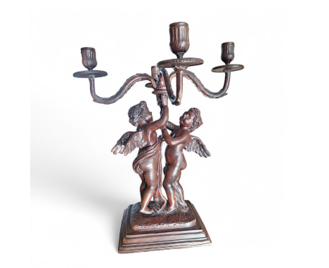 A 20th C Bronzed effect metal 4 sconce candelabra with winged cherubs, on an oblong base . Standing 43 cm ( 17 " ) tall  Cond
