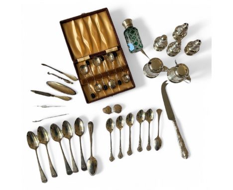 A collection of silver tableware.  To include a case set of coffee bean spoons; a set of six scrollwork handled teaspoons; a 