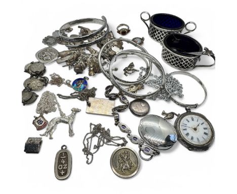 A collection of silver jewellery, white metal jewellery and small silver items. To include a charm bracelet with 38 silver ch