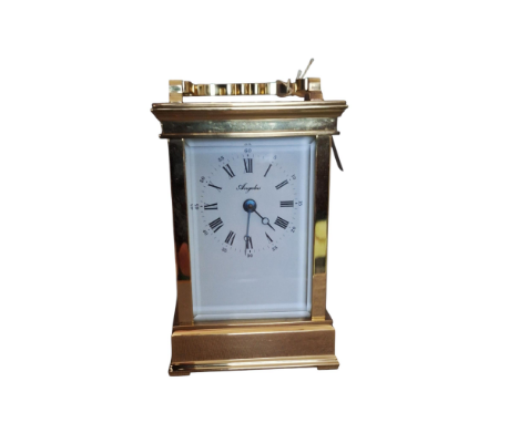 An Brass Angelus carriage clock c1980 Comes with its key and its original box with paperwork. It stands 11.5 cm tall Conditio