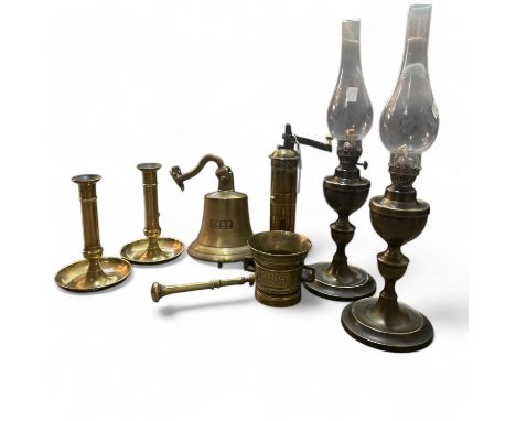 Spice grinder, bell, lamps, candlesticks and other brass items