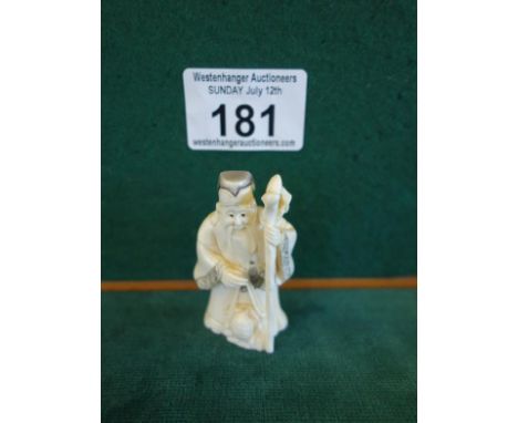 Carved Netsuke 2" tall Man holding Staff, marked to the base you can now bid live on all our lots via thesaleroom.com Westenh