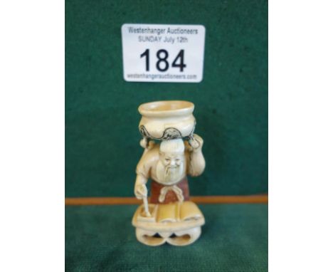 Unusual Netsuke of a Man with a Cauldron on his head, 2.1/4" tall marked to base you can now bid live on all our lots via the