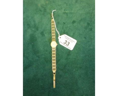 Delicate Ladies 9ct gold gate link bracelet oval faced wrist watch by Tissot, 9ct gold strap and body, total weight 13 grams 