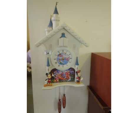 Novelty Cuckoo style wall clock modelled as Mickey and Minnie Mouse and various Disney figures, battery operated 14" tall You