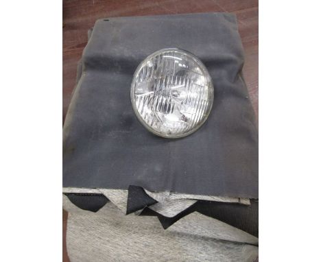 A Lucas motorcycle light and a vinyl roof for a classic car