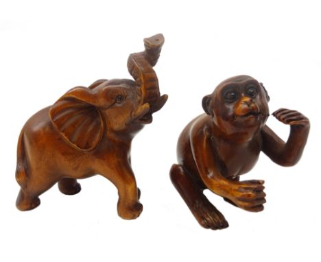 Japanese Meiji boxwood Netsuke carved as a monkey, L5cm and Elephant, both with glass eyes and signatures (2) Provenance: pri