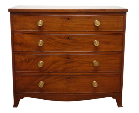 Regency period mahogany bow front chest, the four graduated cockbeaded drawers with brass drum handles, on shaped apron with 