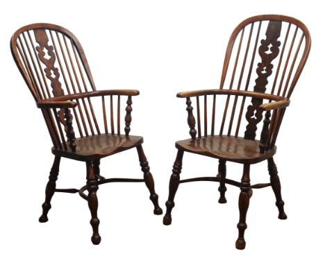 Matched pair early 19th century ash and elm high back Windsor armchairs, pierced shaped splat and stick back, turned supports