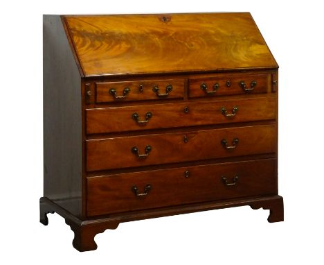 Early 19th century mahogany bureau, fall front enclosing inlaid interior fitted with drawers, cupboards and compartments, abo