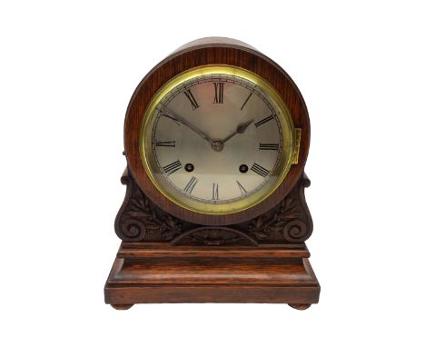 20th century Regency style oak cased arched top bracket clock, circular silvered Roman dial and brass bezel, twin train movem