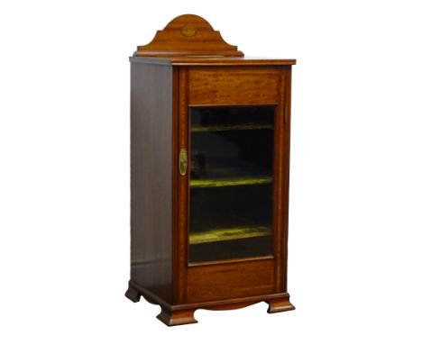 Edwardian satinwood banded mahogany music cabinet, raised back and top inlaid with shell ovals, glazed door with three shelve