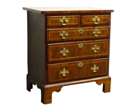 Small early 18th century walnut chest of two short and three long drawers with brass swan neck handles on shaped bracket feet