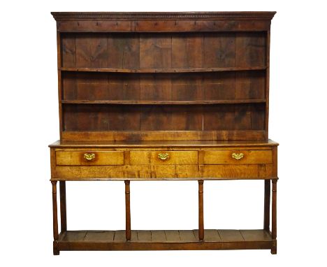 18th century oak dresser, twin shelf back with moulded cornice and dentil frieze with iron hooks, base with three drawers on 