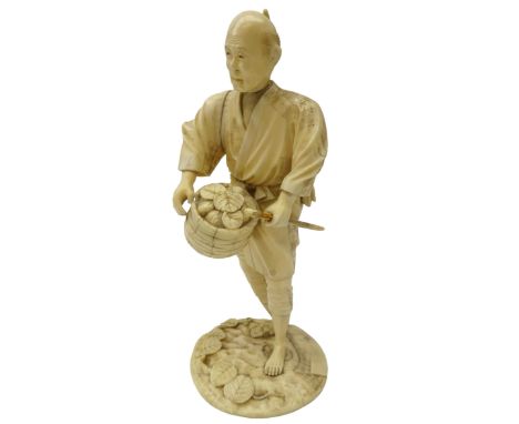 Japanese Meiji period carved ivory figure of a Farmer dressed in a robe, holding a basket and stick, signature to base, H21cm