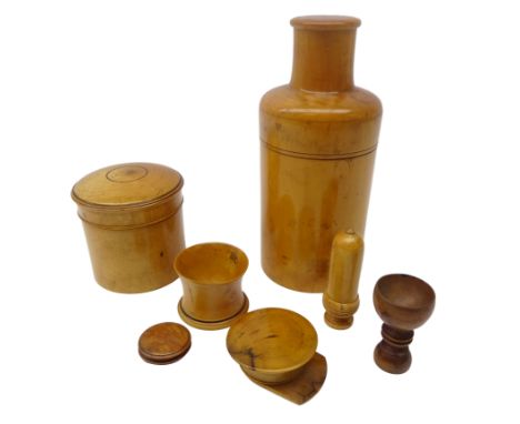 Collection of 19th century and later turned treen; Boxwood bottle case, cylindrical power jar and cover, patch box in the for