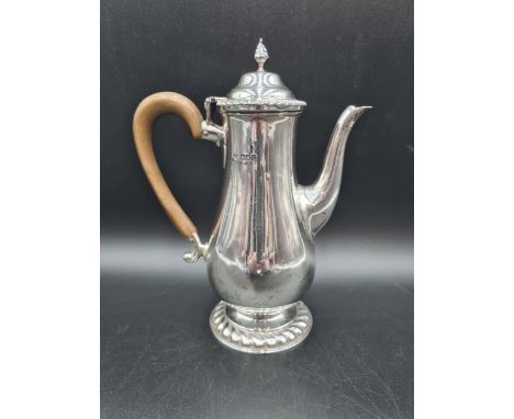 A George V silver baluster Coffee Pot with gadroon rims, bud finial, wooden scroll handle, London 1915, 580gms all in